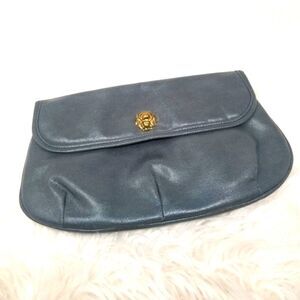BAGGS CLUTCH PURSE. LION HEAD DETAIL.